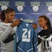 Lynx top draft choices Nicky Anosike, left, and Candice Wiggins looked at their new jerseys at a news conference earlier this month.
