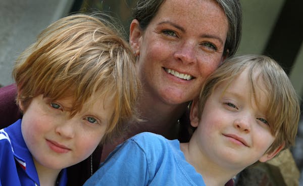 Betsy Chastain with sons Henri, 7, left, and Miles, 5. She isn’t happy about paying $3,000 for Miles to go to full-day kindergarten at Minneapolis�