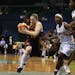 Sun guard Lindsay Whalen drove to the basket for two points against Candice Wiggins and Nicky Anosike in the fourth period on Tuesday night. Whalen fi