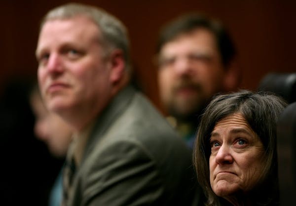 Elections administrator Michele Mcnulty, right, Jim Gelbmann (deputy secretary of state) and Bert Black looked at ballots on a monitor as the state Ca