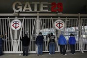 Fans stood outside one of the Target Field gates before the ballpark opened in 2010.