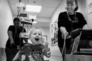 At the intensive care unit of the U of M Amplatz Children's Hospital, Riley Stearns gets his exercise by going around the unit with the Berlin Heart p