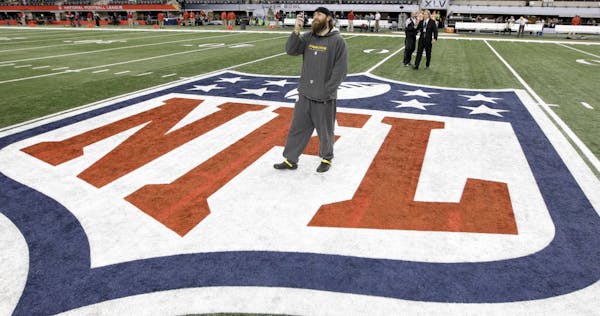 Feb. 6, 2011: Pittsburgh Steelers' Brett Keisel takes a photo on the field before Super Bowl XLV between the Steelers and the Green Bay Packers in Arl
