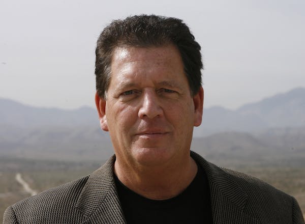 Michael Crosby, chief managing partner of Palmwood Golf Club, is shown in a 2006 file photo. Behind him are his 1,766 acres outside of Desert Hot Spri