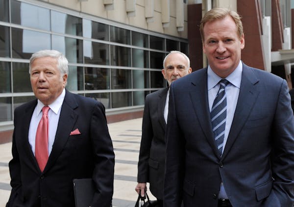 Patriots owner Robert Kraft, left, and NFL Commissioner Roger Goodell, right, left the federal courthouse along with NFL outside attorney Bob Betterma