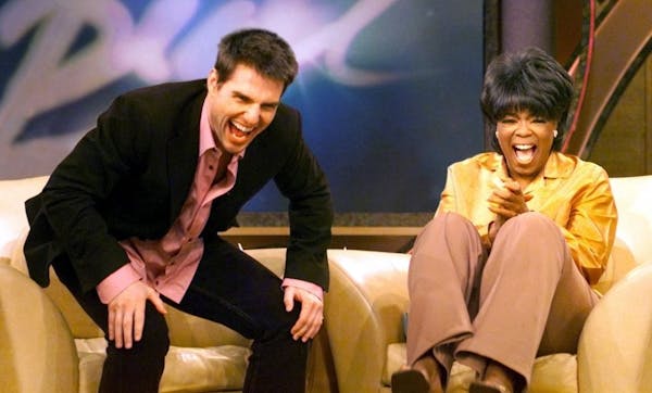 Actor Tom Cruise, left, and talk show host Oprah Winfrey during taping of Winfrey's show 12/06/01