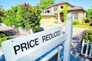A home for sale is posted at a reduced price in Palo Alto, Calif., Thursday, June 24, 2010. Mortgage rates fell this week to the lowest level on recor