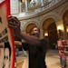 C. J. Turner, of Minneapolis, chanted to tax the rich during a protest in the rotunda at the state capitol with hours left until a government shutdown
