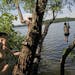 A rope swing at Long Lake was a popular place for people seeking relief from Monday's sweltering heat.