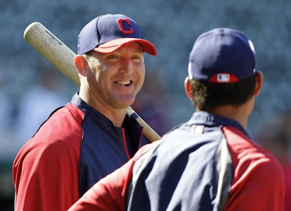 Cleveland Indians' Jim Thome, left, talks with Kosuke Fukudome during batting practice before a baseball game against the Kansas City Royals Friday, A