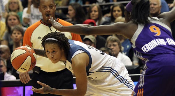 Seimone Augustus looked for a path to the basket against the Mercury's Marie Ferdinand-Harris.