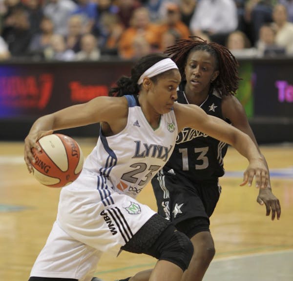 The Lynx's Maya Moore drove to the net in the fourth quarter against the Stars' Danielle Robinson Tuesday night