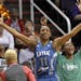 Lynx guard Candice Wiggins (11) and Monica Wright start celebrating in the closing moments of Sunday's 103-86 victory over Phoenix to advance to the W