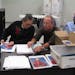 East Suburban Resources’ Tim Pietraszewski showed a worker how to assemble a booklet on hip surgery that will be used at Lakeview Hospital.