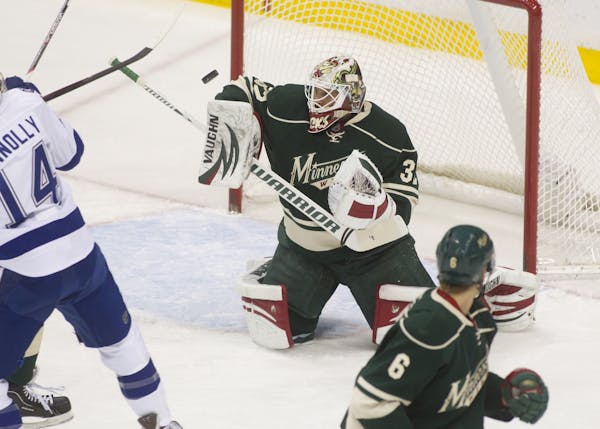 WIld goalie Niklas Backstrom stopped a point with his arm in the first period against the Tampa Bay Lightning at the Xcel Energy Center Monday, Novemb