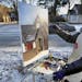 Artist Christina Plichta braved some of the coldest weather of the year to continue work on her oil painting of the Episcopal Church, St. James on the