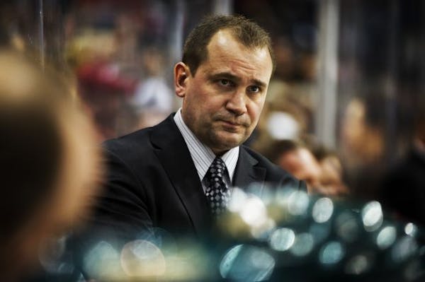 Former Wild coach Todd Richards, who was fired Monday, behind the bench during a game this season against the Vancouver Canucks.