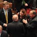 Sen. Amy Koch is greeted and hugged as she arrives on the Minnesota Senate floor Tuesday, Jan. 24, 2012, in St. Paul. Sen. David Senjem, right, is the