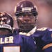 Minneapolis, MN 10/3/99 Vikings vs. Tampa Bay Buccaneers -- Viking defensive end Chris Doleman, right, congratulates teammate Corey Miller after Mille