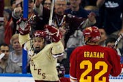 Boston College’s Steven Whitney celebrated after scoring a goal in the first period Saturday as Ferris State goalie Taylor Nelson and Derek Graham l