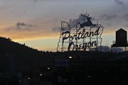 The prominent "Portland Oregon" sign with the leaping stag is a designated city landmark, but its words have changed several times since the 1940s.