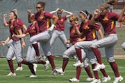 The Gophers softball team warmed up during practice. Despite their power-hitting prowess, their chances for an NCAA bid are slim.