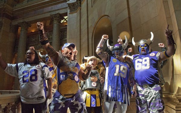 Purple-clad Vikings fans roamed the halls of the Capitol Thursday trying to drum up support for the stadium bill. They sang Skol Vikings outside the H