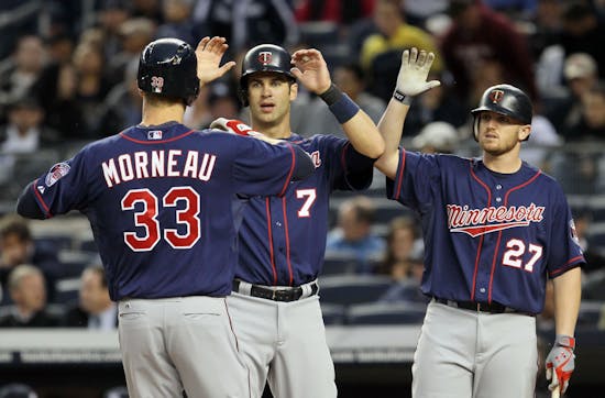Morneau belts two HRs; Marquis earns first Twins victory