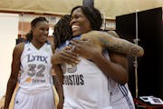 Minnesota Lynx Taj McWilliams-Franklin was greeted with a hug by teammate Seimone Augustus and Rebekkah Brunson during media day for the championship 
