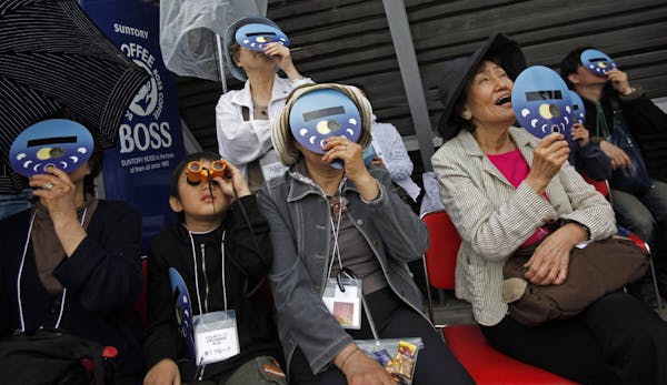 Millions watch eclipse crossing Asia, U.S.