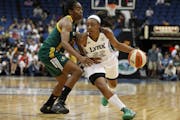 The Lynx's Monica Wright dribbled past Seattle's Victoria Dunlap during Minnesota's 79-55 rout of the Storm at Target Center on Wednesday night..