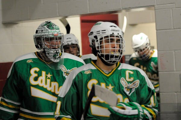Louie Nanne, right, with Edina goalie Willie Benjamin, was drafted by the Wild on Saturday in the second round of the NHL draft.
