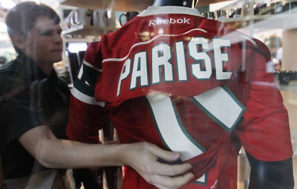 At the Hockey Lodge store at Xcel Energy Center, store manager Bill Berg put a Parise jersey over Grandlund's on a store mannequin.