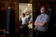 Satchel Moore, right, wore raw denim at BlackBlue in St. Paul, which he manages. Owner Steve Kang was reflected in the mirror.