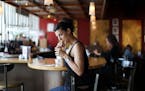 Local rapper/ singer Dessa Darling sipped on her favorite drink, a black belt, at her usual spot on the bar at Fuji-Ya in Minneapolis, Minn., Sunday, 