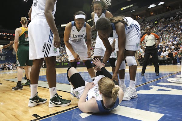 Taj McWilliams-Franklin helped up teammate Lindsay Whalen after she hit the deck going after a loose ball in the second quarter.