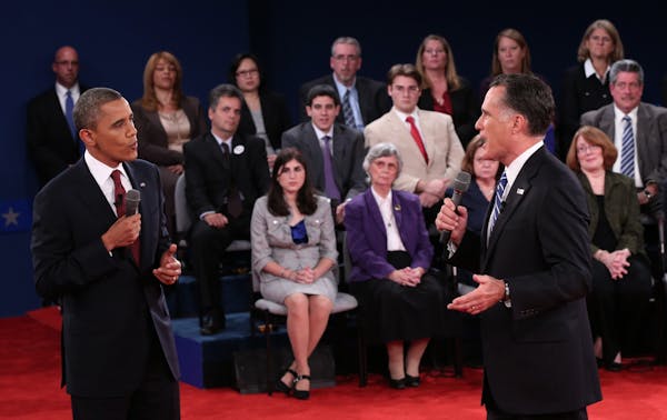 Romney, Obama joust over tax plans, debt