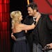 Miranda Lambert, left, and Blake Shelton embrace onstage after winning the award for song of the year for "Over You" at the 46th Annual Country Music 