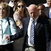 Former Democratic Rep. Gabrielle Giffords, left, and her husband Mark Kelly leave after the sentencing of Jared Loughner, in back of U.S. District Cou