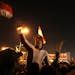 Egyptian protesters attend an opposition rally in Tahrir Square in Cairo, Egypt, Tuesday, Nov. 27, 2012. Thousands flocked to Cairo's central Tahrir s