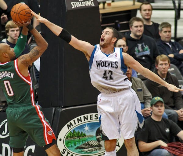 A leaner, slicker Kevin Love stretched out on defense to guard the Bucks' Drew Gooden on Saturday at Target Center.