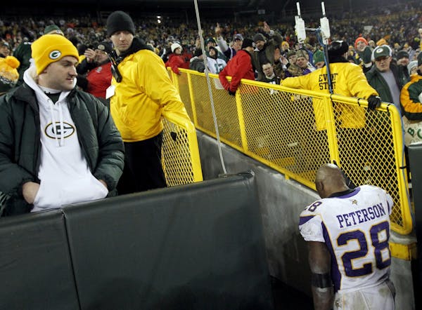 Vikings running back Adrian Peterson walked off the field after Green Bay beat Minnesota 24-10 in the playoffs.