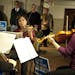 Members of the Saint Paul Chamber Orchestra played outside the room where the Minnesota House Commerce and Consumer Protection Committee was examining