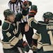 Minnesota Wild vs. Dallas Stars. Wild's Dany Heatley (15) and Zach Parise celebrated after Parise scored his first goal of the season in first period 