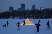 Thousands of ice luminarias light the path on Lake of the Isles during the Luminary Loppet in 2013.