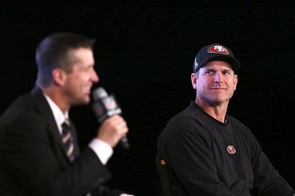 Harbaughs hold joint press conference