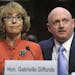 Former Arizona Rep. Gabrielle Giffords, who was seriously injured in the mass shooting that killed six people in Tucson, Ariz. two years ago, sits wit