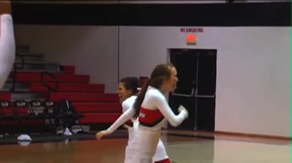 Cheerleader makes flip, half-court shot
