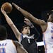 Timberwolves guard Alexey Shved shoots as Oklahoma City Thunder forward Kevin Durant defends.