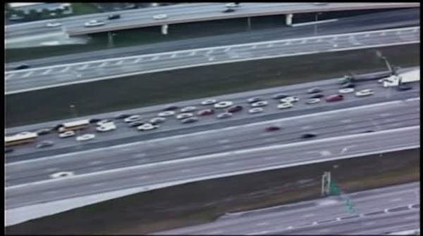 Truck dangles off Florida highway overpass